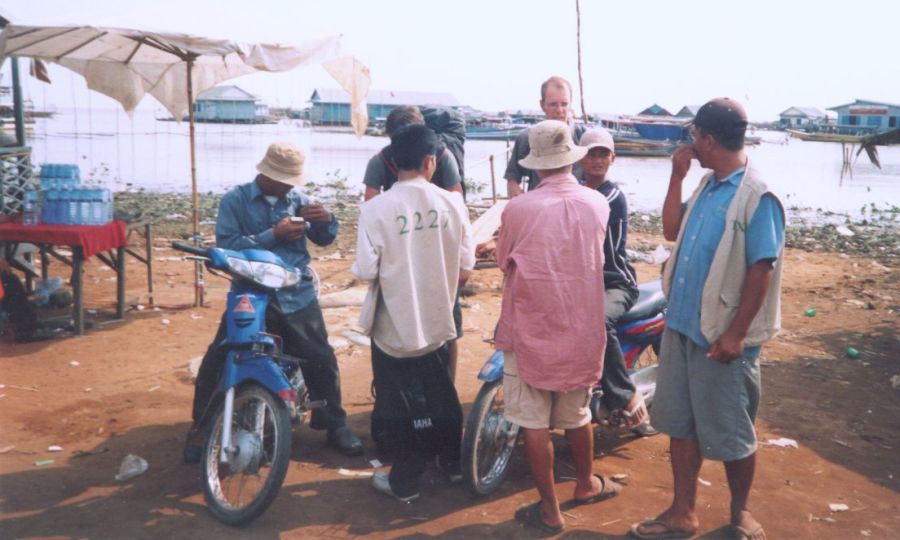 Negotiating for motorbike taxi at Tonle Sap Lake in NW Cambodia