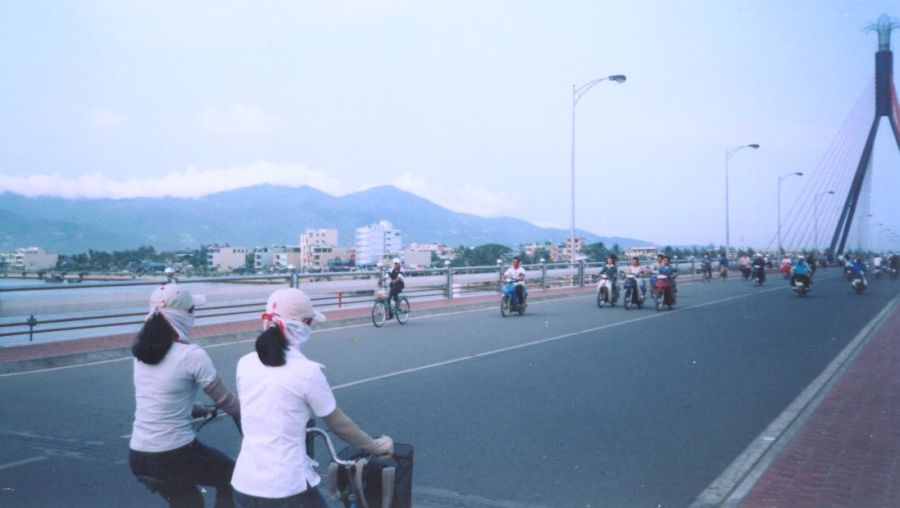 Cyclists on Thuan Phuoc Bridge over Han River in Danang