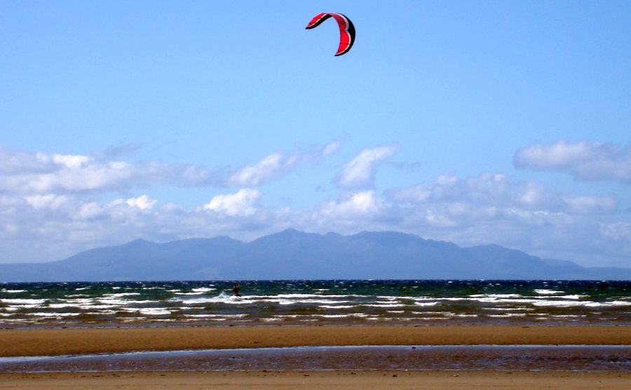 Kite surfer and Isle of Arran on the Ayrshire Coastal Path from Troon to Irvine