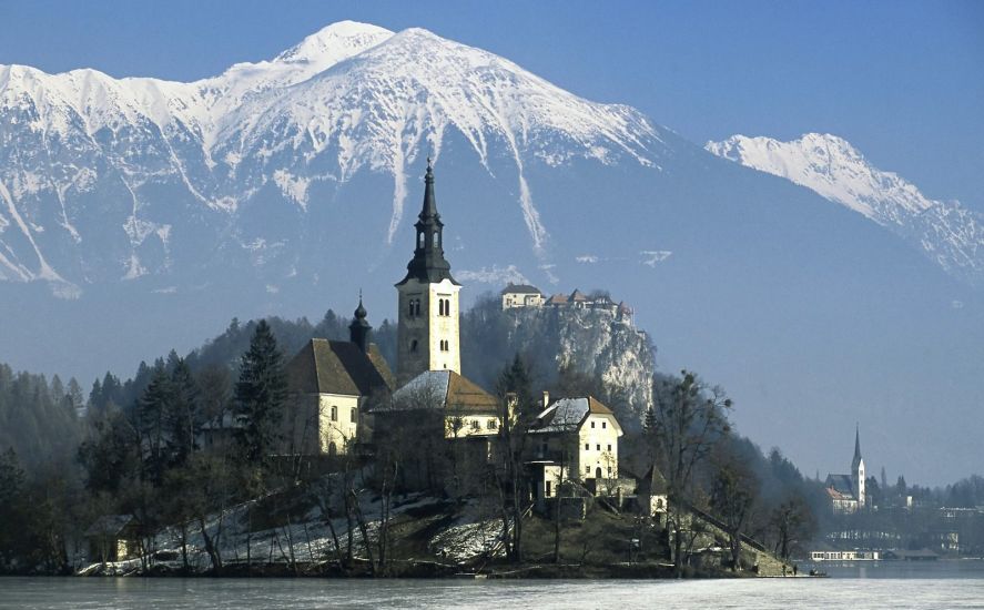 Church on Island in Lake Bled beneath the Karavanken Mountains in Slovenia