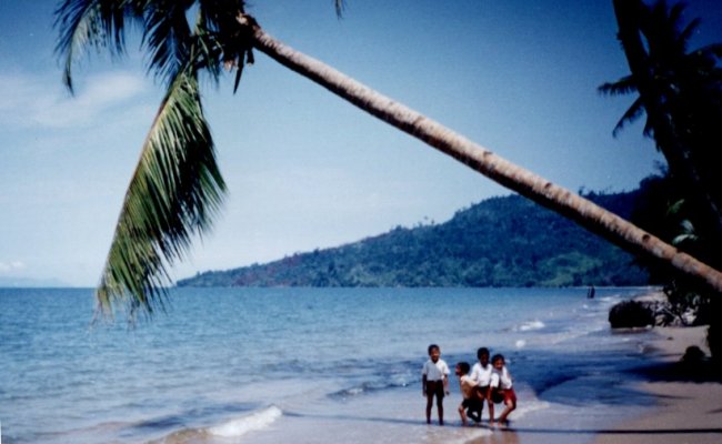 Indonesian Children on beach near Sibolga on the West Coast of the Indonesian Island of Sumatra