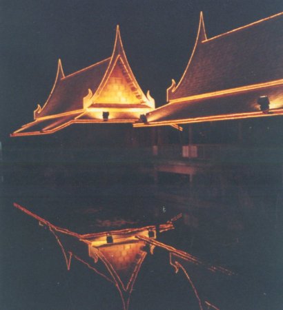 Traditional-style Buildings illuminated at night in Phitsanulok in Northern Thailand