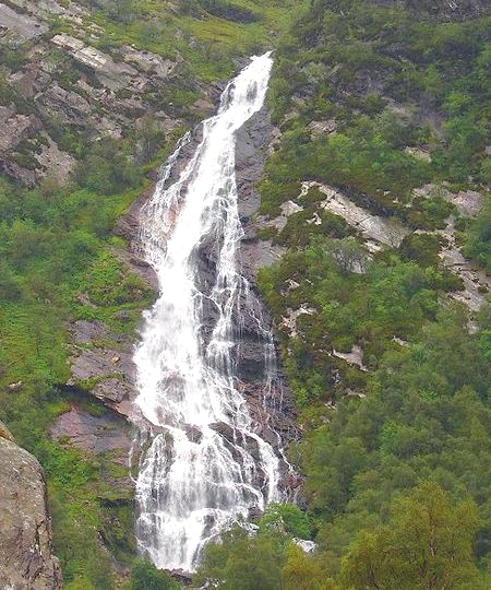 Steall waterfall in Glen Nevis beneath An Gearanach in the Mamores above Glen Nevis